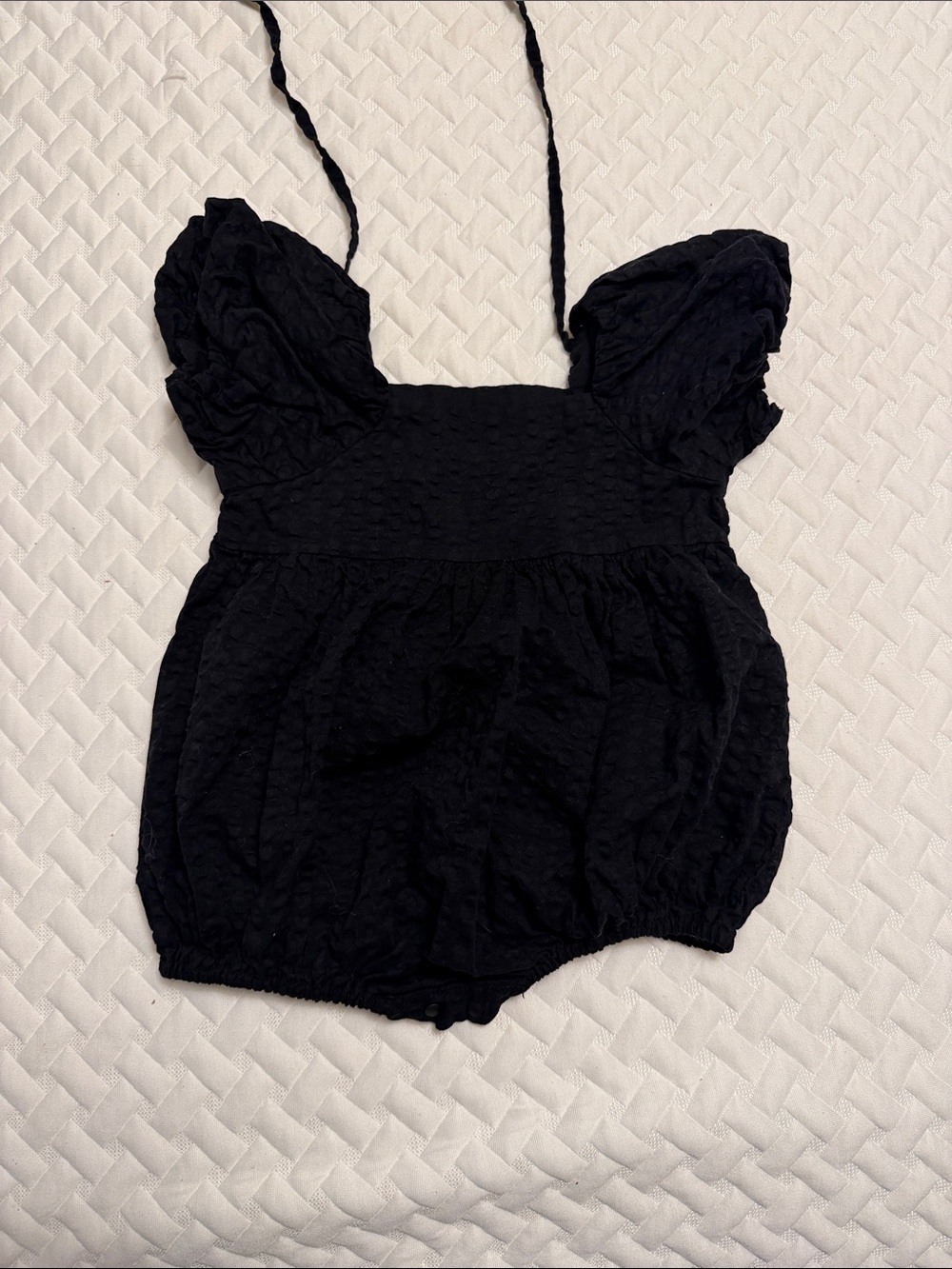 Baby Black Puff-Sleeve One-Piece Bodysuit, ties in back & snap close bottom.
